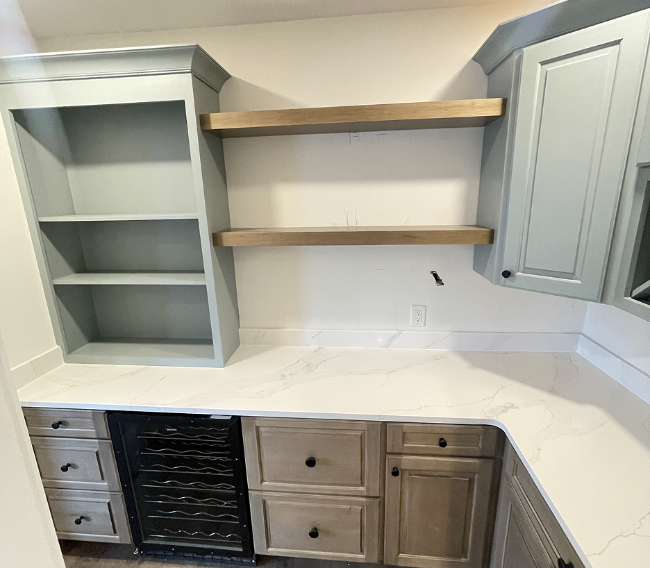 Gray custom entertainment built-in installed by a finish carpenter in Cape Cod