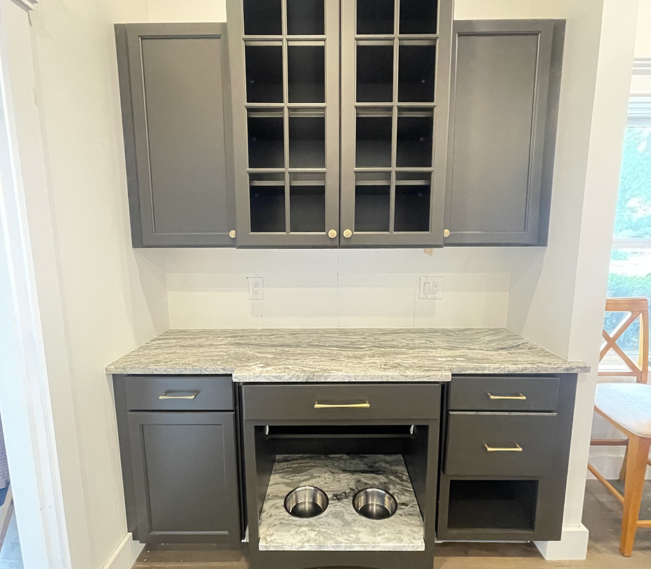 Custom kitchen cabinets and floating shelves installed in Cape Cod