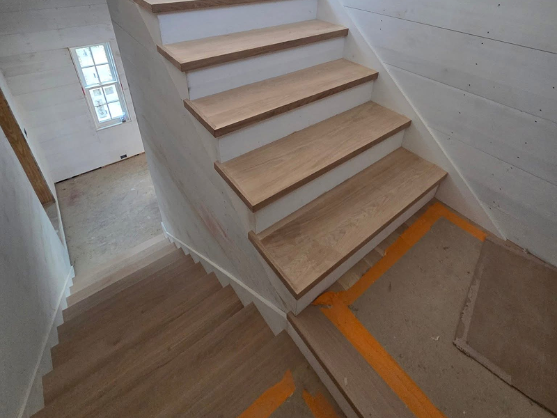 Custom wooden staircase installation in Cape Cod home